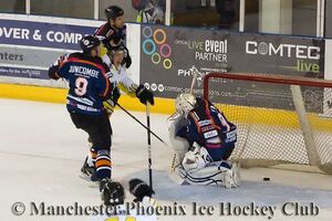 Tom Duggan wraps the puck around the net for Phoenix's first goal