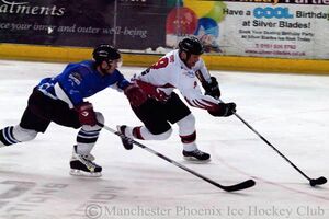 Tony Hand makes his way with the puck to the Sheffield net