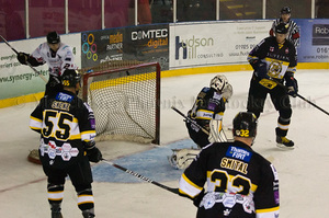 The puck heads under the bar for the second goal