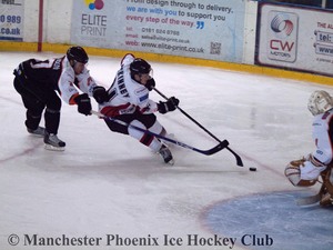 Andy McKinney charges the Phantoms' net