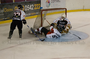 Andy McKinney collides with the Phantoms net