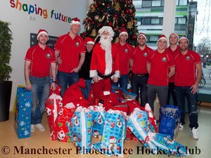 Santa, Neil Morris and the team ready to give out the presents