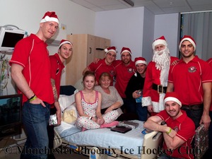 Santa and the team give out a present