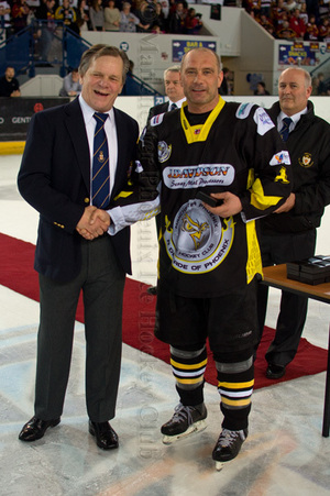 Tony Hand receives his winners medal