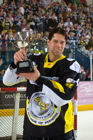 Joachim Flaten holds the trophy in front of the fans