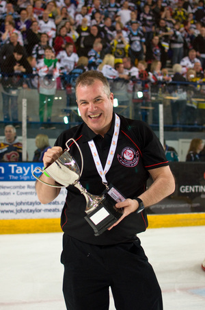Neil Morris holding the play-off cup.