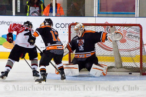 The puck crosses the line for the Phoenix's third goal