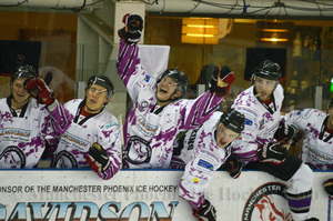 The bench celebrating James Neil's second goal of the game