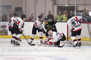 Phil Spanswick covers the puck