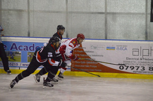 Players race for the puck
