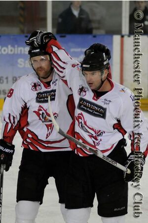 Huppe and Kristofferson celebrate a goal