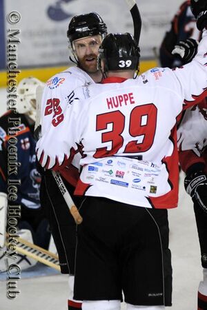 Huppe celebrates a goal with Kristoffersson