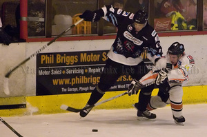 Stephen Wallace battles for the puck