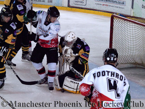 Tom Duggan looks for the puck