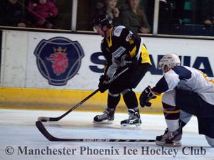 Ondrej Pozivil takes the puck into the defensive zone of the Flames