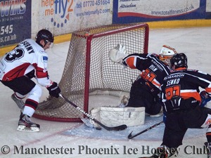 Michal Psurny Tries To Net The Puck
