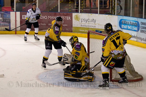 The puck slips past Tom Annetts for Phoenix's first goal