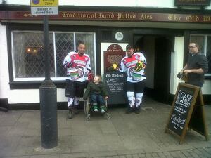 Peter Hagan and Steve Bradley finish the 100-mile walk outside The Windmill Pub in Coventry