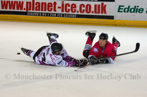 James Neil puts his body on the line against Nicky Chinn in a dive for the puck