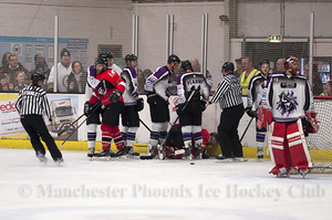 Tempers fray following a collision behind the net