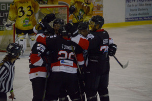 The team celebrates after the third goal