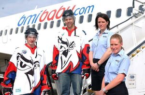 Phoenix players and hostesses in front of bmibaby plane