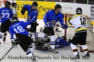 Ben Wood finds a gap through a crowded Sheffield net for Phoenix's fourth